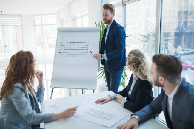 Colleagues attending seminars and business meetings in company office