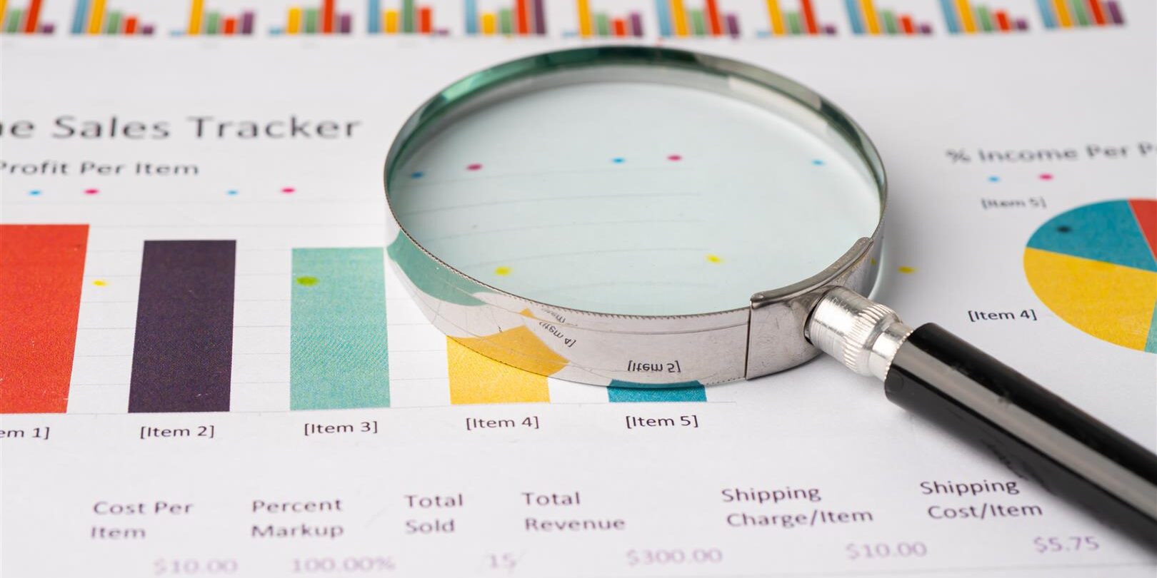 magnifying glass on charts graphs paper 2026 01 08 06 56 30 utc