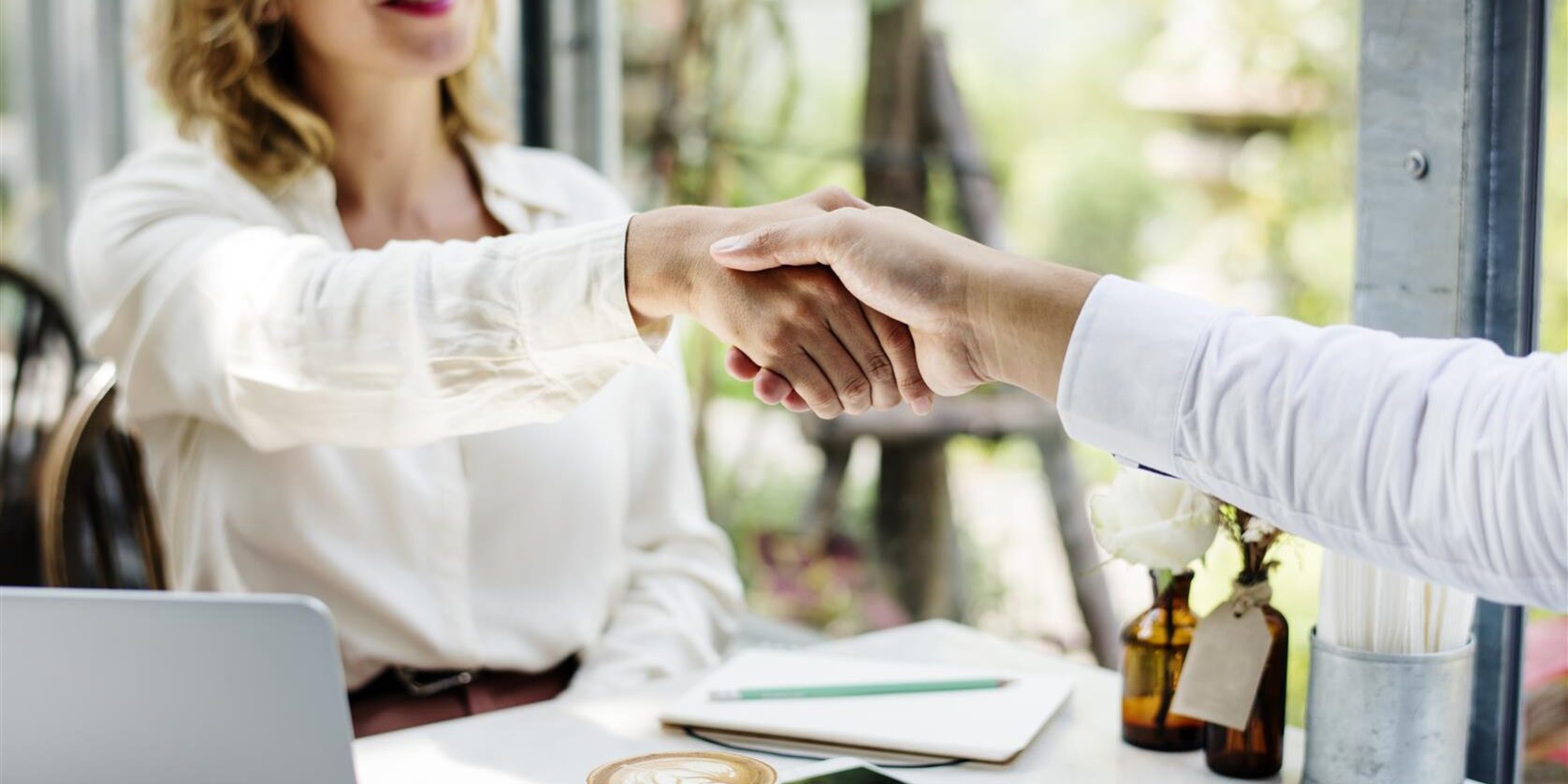 business handshake at cafe during daytime meeting 2026 03 18 11 10 22 utc
