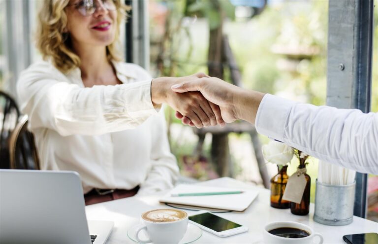 business handshake at cafe during daytime meeting 2026 03 18 11 10 22 utc