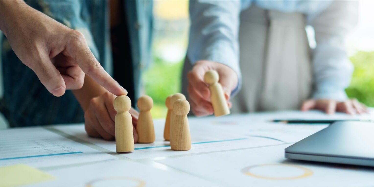 business team strategizing with wooden figures on 2026 03 16 04 29 19 utc