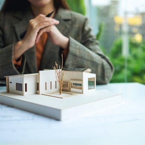architect examines model of building in office 2026 09 21 07 51 42 utc